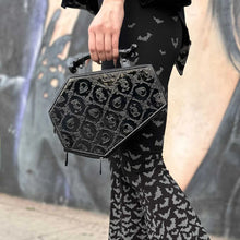 Load image into Gallery viewer, model holding bag wearing bat leggings