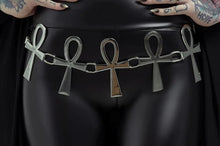 Load image into Gallery viewer, Model wearing a black outfit with a silver belt featuring ankh symbols on a plain background