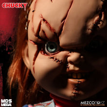 Load image into Gallery viewer, Close-up of a Chucky doll with red hair and visible eyes, branded by Mezco Toyz.
