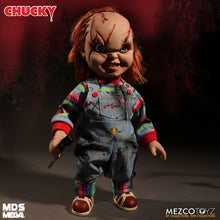 Load image into Gallery viewer, Chucky doll with red hair and striped shirt holding a knife, Mezco Toyz brand visible