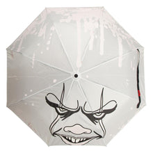 Load image into Gallery viewer, White umbrella with Pennywise IT clown face screen printed on it. Color changing art when wet.