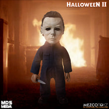 Load image into Gallery viewer, Doll wears tailored, weathered coveralls, features 11 points of articulation, and comes complete with a butcher knife accessory that fits neatly in his right hand.