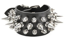 Load image into Gallery viewer, Black leather bracelet with three rows of silver spikes. Top and bottom row consist of 1/2" silver spikes. Center row consists of 1" silver spikes.