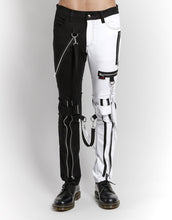 Load image into Gallery viewer, front of Classic slim White/Black split leg pants with removable bondage straps and zipper details. Pant legs can be zipped for a change in fit, topped off with a zip fly and button closure.