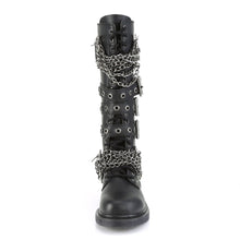 Load image into Gallery viewer, front view of black vegan leather knee high combat boot with 1.25" heel, 20 eyelet lace-up, brass knuckle with chain on top of shoe and base of shoe with three adjustable straps in the middle, full zipper on backside