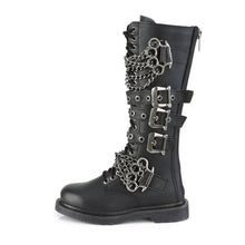 Load image into Gallery viewer, left side view of black vegan leather knee high combat boot with 1.25" heel, 20 eyelet lace-up, brass knuckle with chain on top of shoe and base of shoe with three adjustable straps in the middle, full zipper on backside