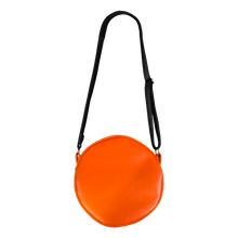 Load image into Gallery viewer, woman wearing bag on shoulder. bag is orange with yellow eyes and yellow teeth, with a black adjustable strap. based on sam's jack o lantern in the movie trick r' treat