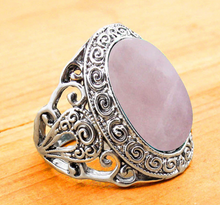 Load image into Gallery viewer, side of Silver colored ring with oval natural pink quartz stone.