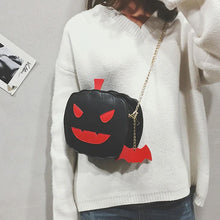 Load image into Gallery viewer, front view of black pumpkin jack o' lantern bag