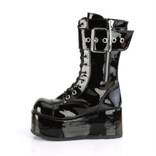 Load image into Gallery viewer, inner side view of Black patent vinyl 3 1/2&quot; platform lace-up mid-calf boot with ornamental inner and outer zipper details, oversized buckle strap and back zip closure.
