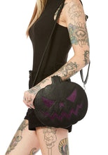 Load image into Gallery viewer, Matte black vinyl jack o lantern purse with sparkly glitter vinyl stitched details. Purse has adjustable strap, zip closure, leopard print satin lining and a zippered pocket on the inside. Can be worn as a cross body bag, or on the shoulder.