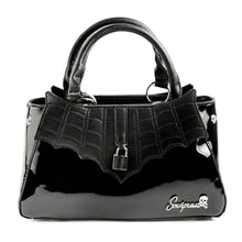 Load image into Gallery viewer, front view of Glossy black purse with silver lock detail on front center. The shell is comprised of glossy black faux leather, with matte leather stitched spiderweb details near the top. Zip closure, inner pockets and little metal feet.