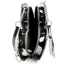 Load image into Gallery viewer, inside view of heart shaped glossy black bag with a stitched spiderweb design at the bottom, chain link hardware and faux leather straps.