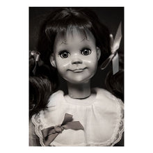 Load image into Gallery viewer, talky tina replica doll with pig tails, wearing a plaid dress with bow around the waist, and black flats with white socks