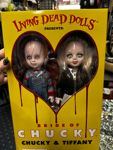 dolls in box on display