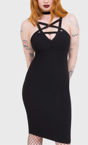 Model wearing a black dress with cut-out pentagram design on a white background