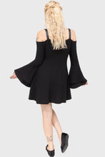 Load image into Gallery viewer, Model wearing a black dress with long sleeves and lace-up front on a white background
