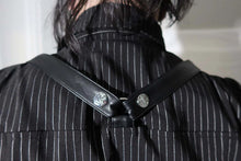 Load image into Gallery viewer, Model wearing a black and white pinstripe tip with tattoos on arms against a white background
