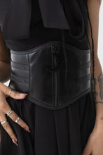 Load image into Gallery viewer, Person wearing a black vegan leather waist belt with a plain background
