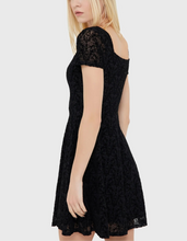 Load image into Gallery viewer, Model wearing a black lace dress on a white background
