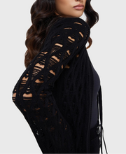 Load image into Gallery viewer, Model wearing a black floor length cardigan on a white background
