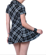 Load image into Gallery viewer, Model wearing black and white plaid dress on a white background

