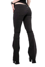 Load image into Gallery viewer, Model wearing black and white pinstripe pants on a white background
