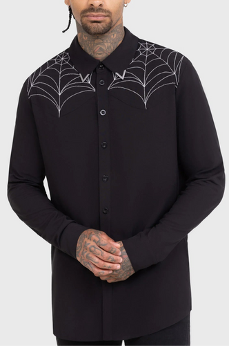 Model wearing a black button up shirt with spider web designs near collar on a white background