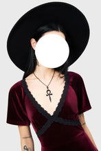 Load image into Gallery viewer, Person wearing a black hat and burgundy velvet dress with a black collar against a white background
