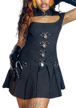 Load image into Gallery viewer, Model wearing black sleeveless dress with metal accents on a white background
