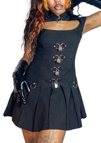 Model wearing black sleeveless dress with metal accents on a white background