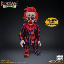 Load image into Gallery viewer, Colorful clown figure with red hair and a striped outfit on a dark background, featuring Mezco Toyz branding.
