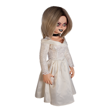 Load image into Gallery viewer, Doll is clothed with a white long sleeve wedding dress and black choker accessory. Has tattoo on right breast of a red heart with a dagger stabbed in it and the text &quot;chucky&quot; above the heart.
