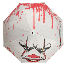 Load image into Gallery viewer, White umbrella with Pennywise IT clown face screen printed on it. Color changing art when wet.
