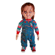 Load image into Gallery viewer, Doll is clothed with good guy overalls, long sleeve shirt and red sneakers. Doll has two black eyes and scars/stitches along face
