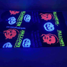 Load image into Gallery viewer, socks on display glowing under blacklight
