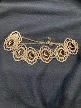 Load image into Gallery viewer, Brass colored multi crescent moon repeat pattern choker.
