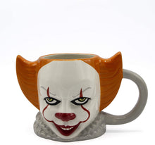 Load image into Gallery viewer, front of Mug is shaped like the head of Pennywise from the IT (2017, 2019) franchise.
