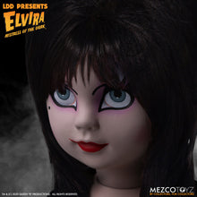 Load image into Gallery viewer, up close view of Elvira Living Dead Doll, with iconic black dress and batty, teased hair, and comes with a dagger that she can store in her waist belt. Stands 10” tall and features 5 points of articulation. Packaged in window box for display.
