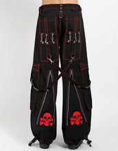 Load image into Gallery viewer, Black classic fit Tripp pants with red stitching, zipper details, removable straps on the back, drawstrings near the feet to tighten the fit, and red skulls printed on the back of each leg.
