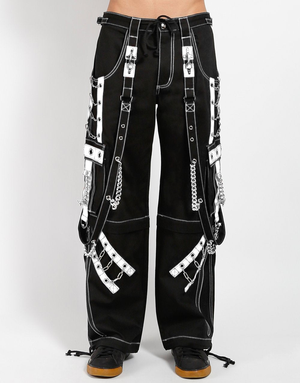 front of Black and white pants feature white stitching, removable straps, adjustable ankles, D-rings, clasps, and deep pockets.
