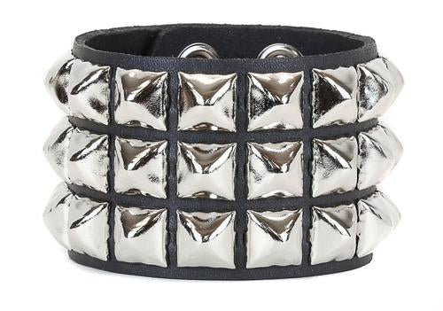 Black leather bracelet with three rows of silver pyramid studs.