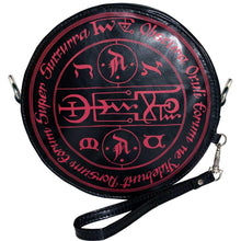 Load image into Gallery viewer, back of Round black vegan leather wristlet purse with a red baphomet print on the front and satanic symbols printed on the back. 
