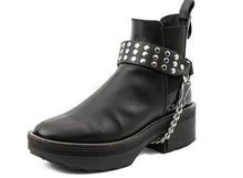 Load image into Gallery viewer, black ankle boot displaying black boot strap with three rows of multiple silver riveted studs and hanging silver chain underneath
