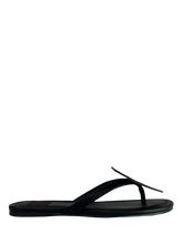 Load image into Gallery viewer, side of Black flat sandal with vegan leather Misfits fiend skull cutout on top. Vegan leather with black rubber outsole.
