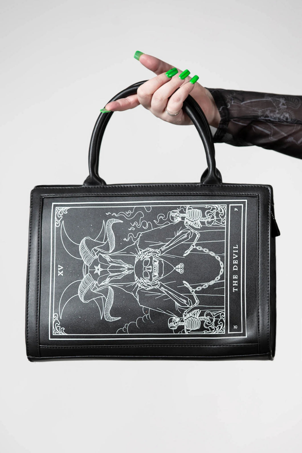 model holding purse
