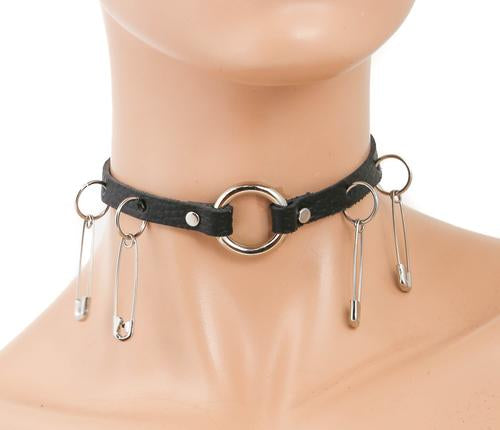 Black leather collar with silver O ring in front center of collar and two small O rings on each side with hanging safety pins.