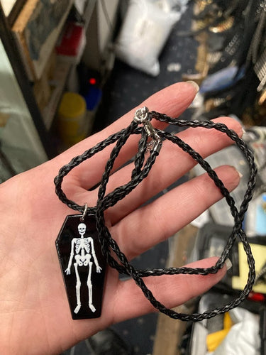 model holding necklace
