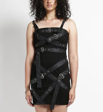 Load image into Gallery viewer, front of Short black dress with adjustable straps and bondage belt details all over the front and back of the dress.
