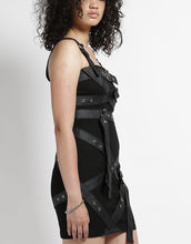 Load image into Gallery viewer, side of Short black dress with adjustable straps and bondage belt details all over the front and back of the dress.
